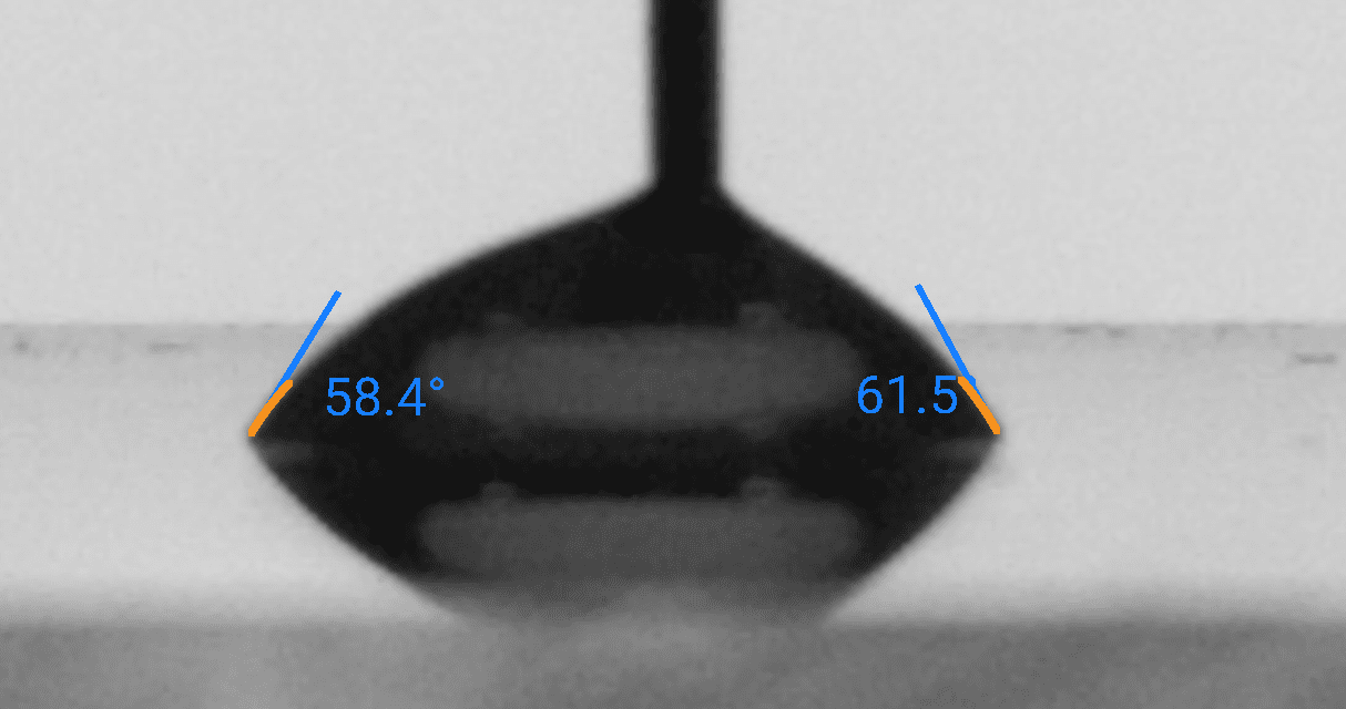 Sessile drop contact angle measurement: DI Water on PMMA, left contact angle 58.4°, right 61.5°